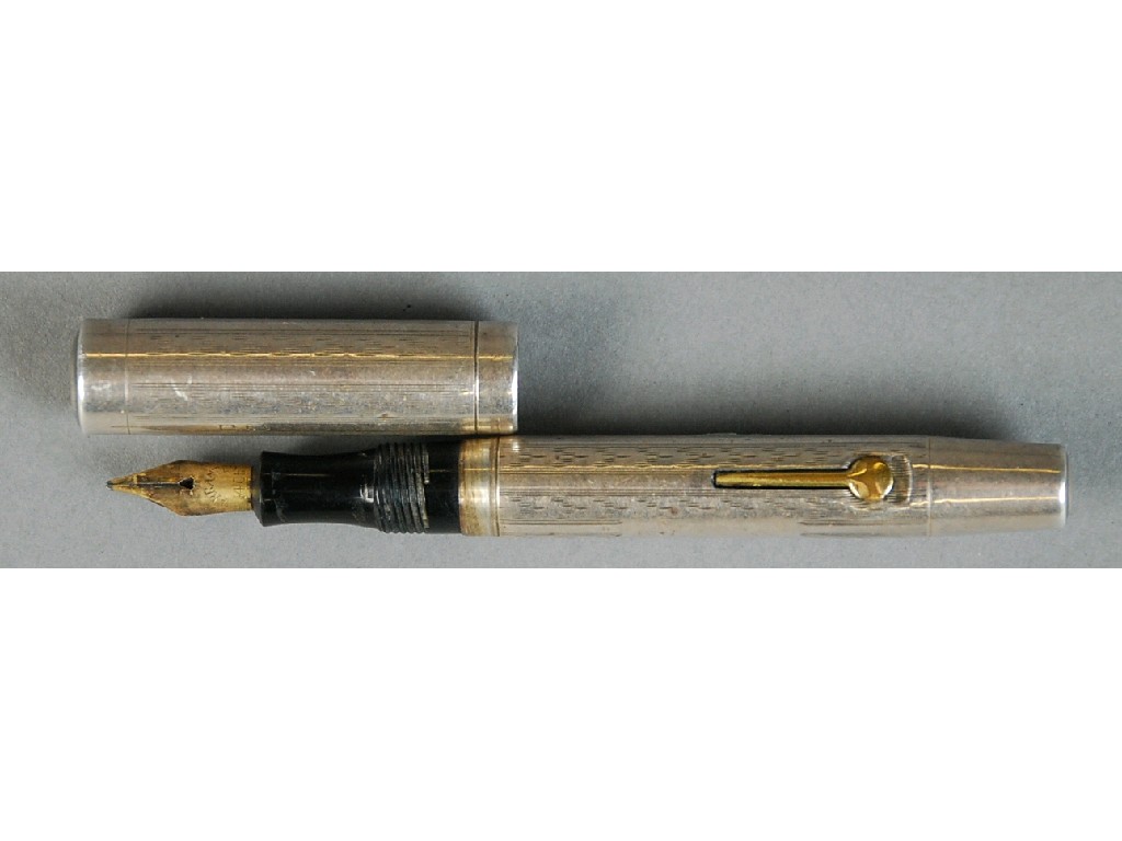 Appraisal: LADY'S ENGINE TURNED SILVER FOUNTAIN PEN with engine turned decoration