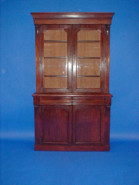 Appraisal: A Victorian mahogany bookcase with moulded cornice door glaze top