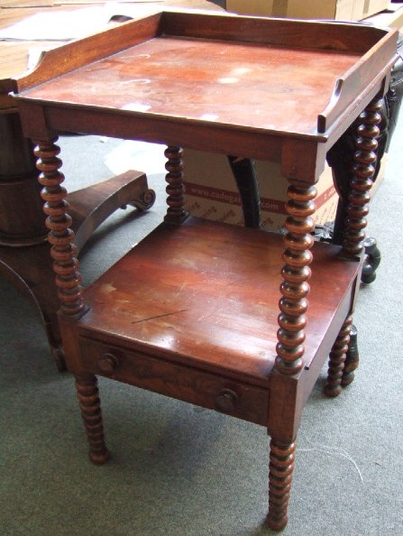 Appraisal: A th century mahogany two tier washstand with gallery top