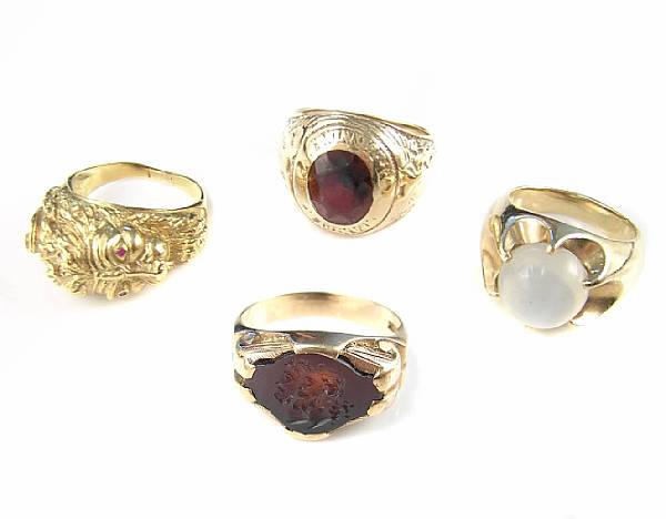 Appraisal: A collection of four gemstone and gold rings comprising two