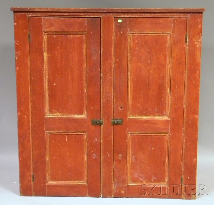 Appraisal: Red-painted Wooden Two-Door Cupboard the interior with three fixed shelves