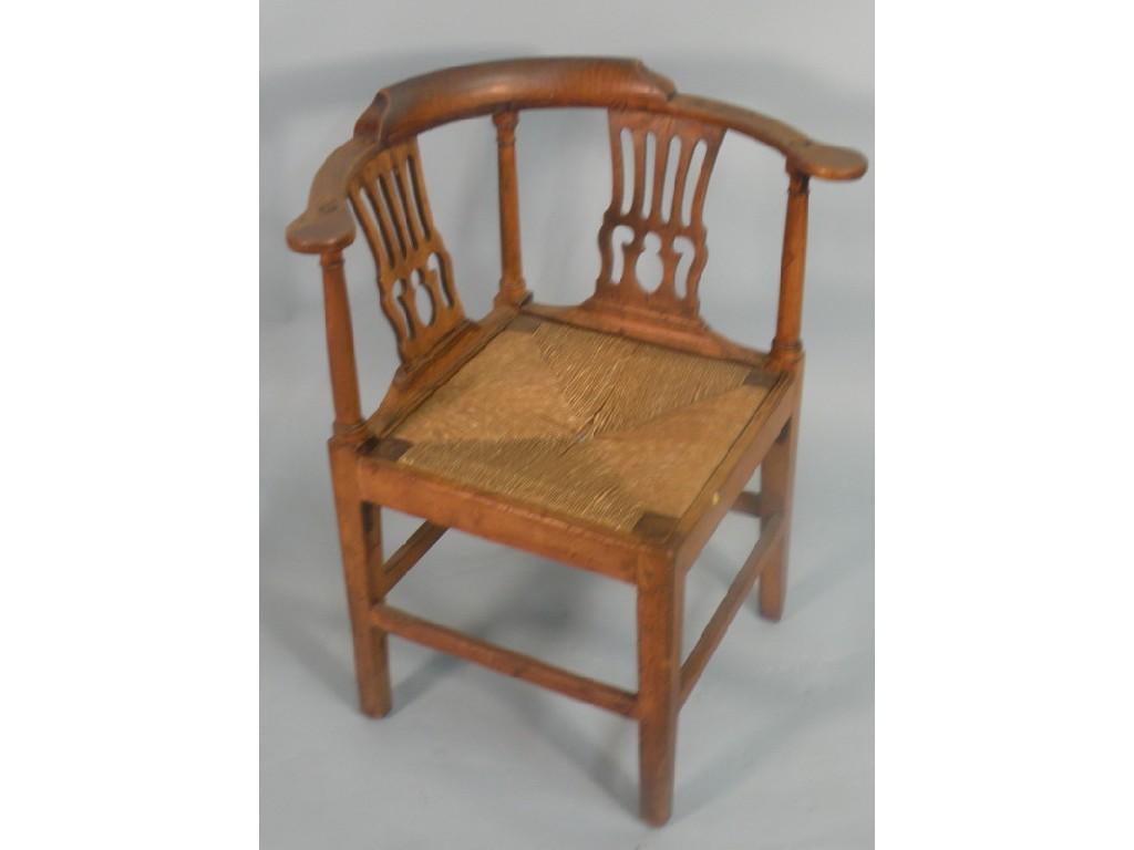 Appraisal: A mid thC fruitwood corner chair with two pierced splats