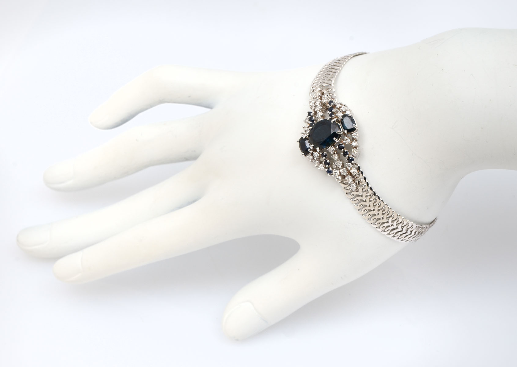 Appraisal: K SAPPHIRE DIAMOND BRACELET Kwhite gold bracelet contains oval faceted