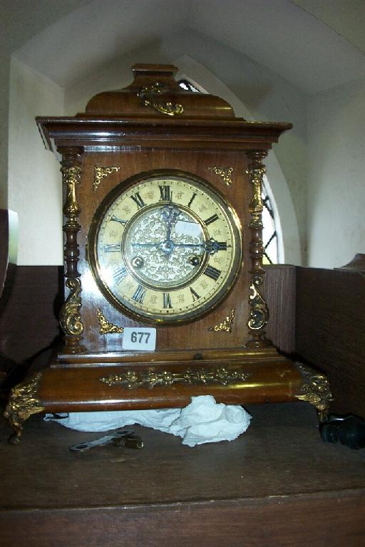 Appraisal: A late th century cottage mantle clock with embossed dial