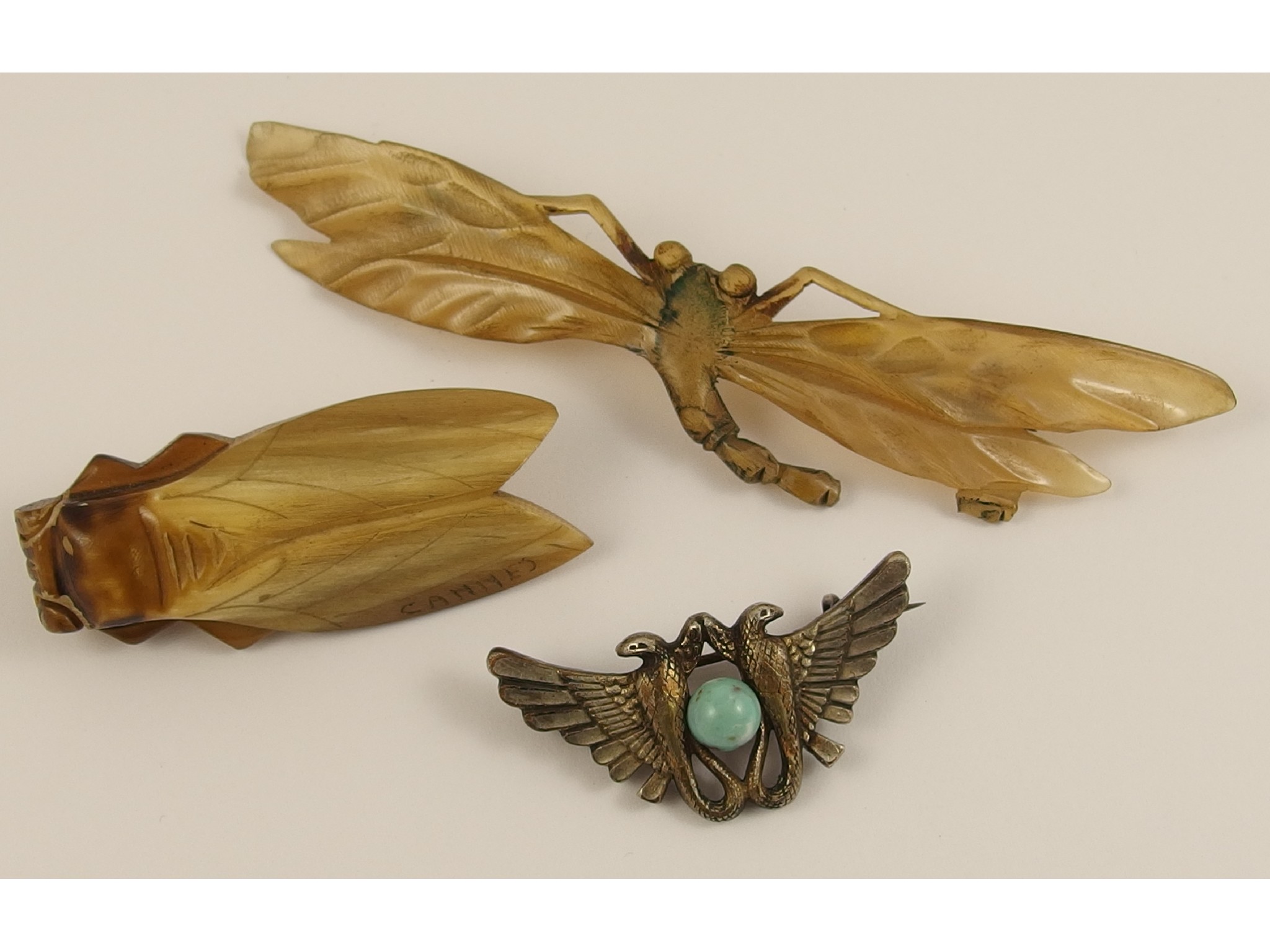 Appraisal: Two horn brooches one a stylised dragonfly unsigned but in