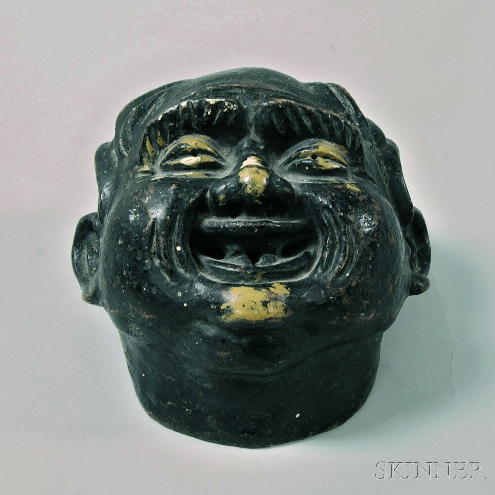 Appraisal: Glazed Pottery Head of a Smiling Chinese Man Fountain Element