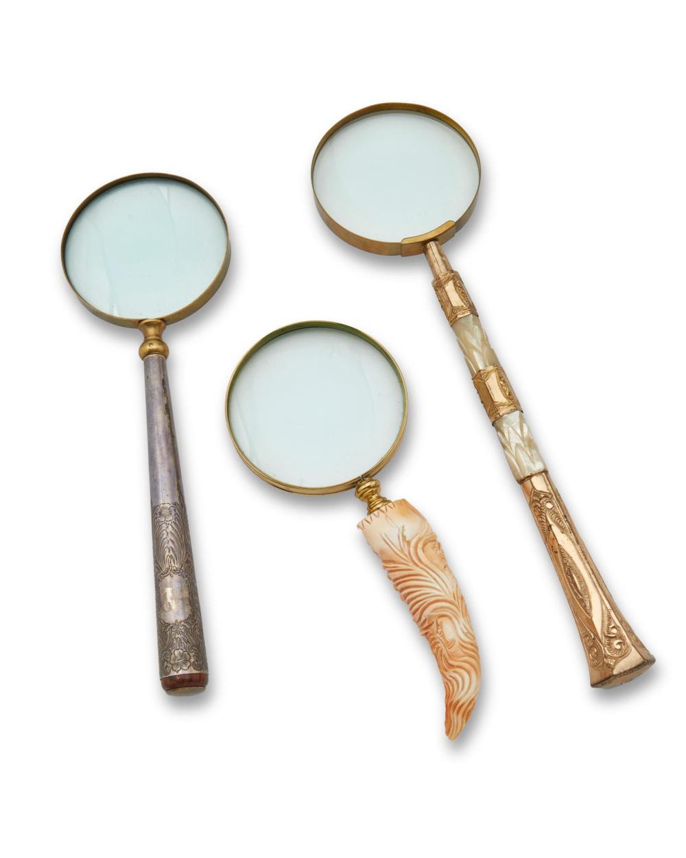 Appraisal: THREE MAGNIFYING GLASSESThree magnifying glasses th century Comprising one with