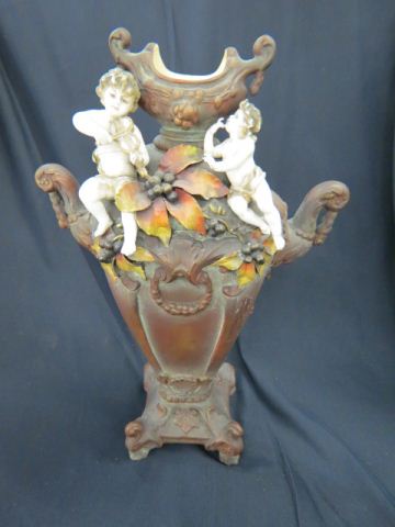 Appraisal: Victorian Porcelain Vasewith applied cherubs or putti near top berries