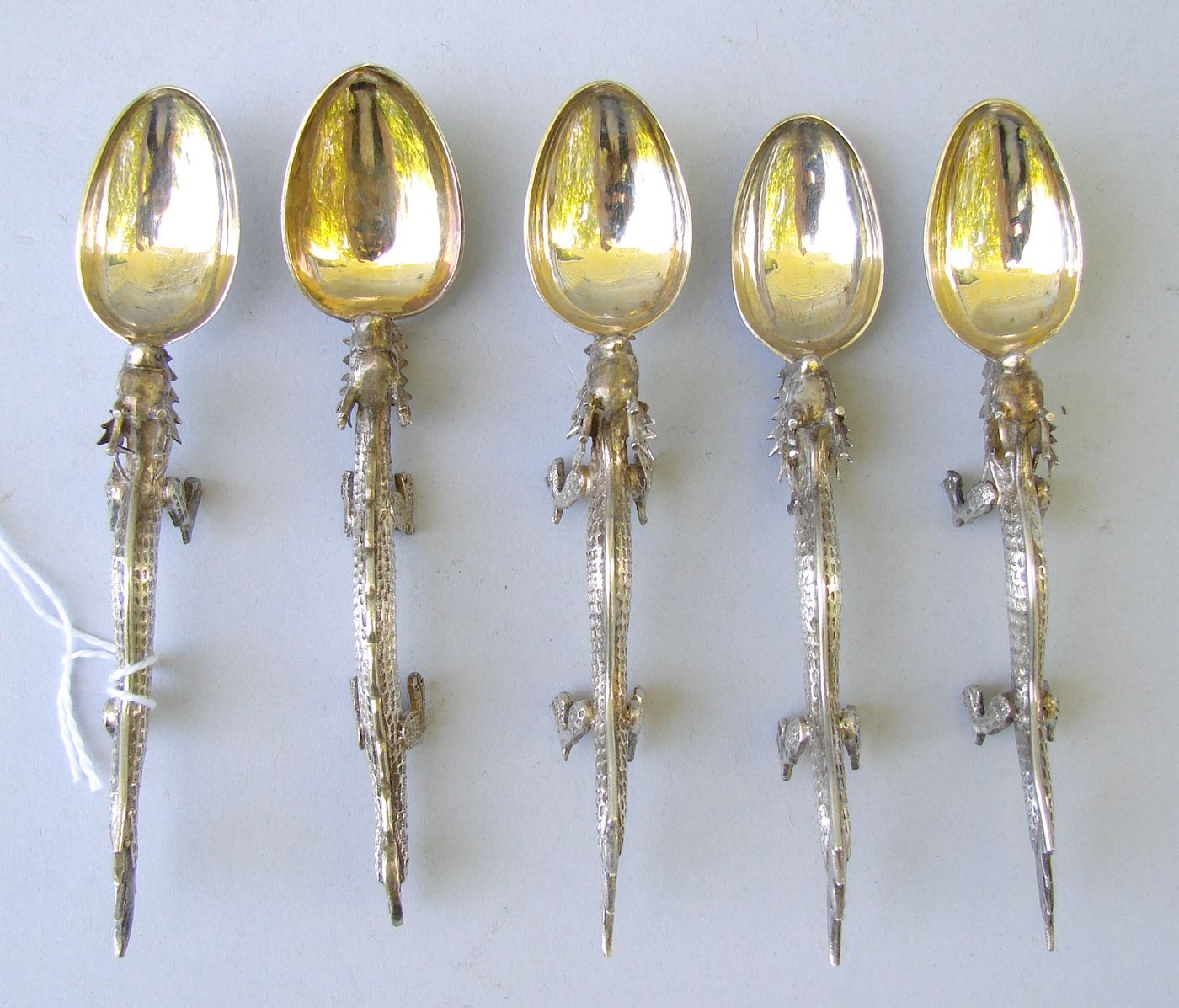 Appraisal: FOUR CHINESE-EXPORT WANG HING CO DRAGON-FORM SPOONS Late th Early