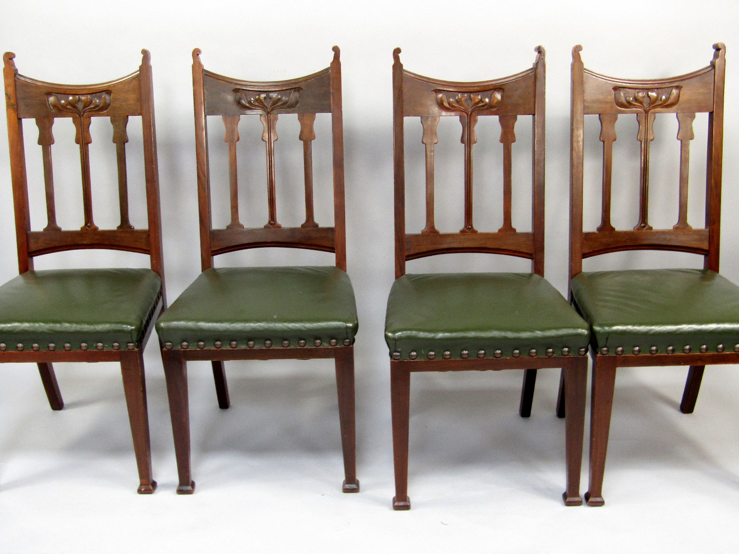 Appraisal: A set of four Edwardian walnut dining chairs with Art