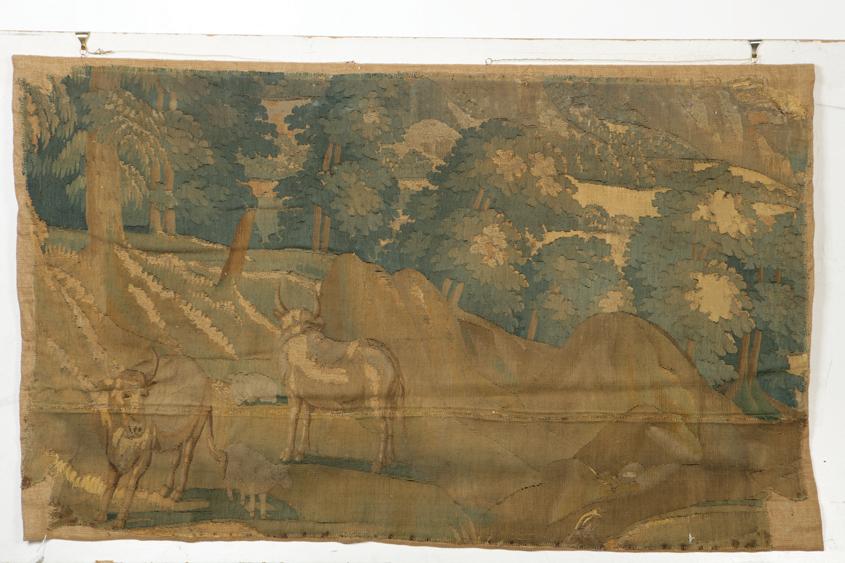 Appraisal: A FLEMISH TAPESTRY FRAGMENT worked in coloured thread with cattle