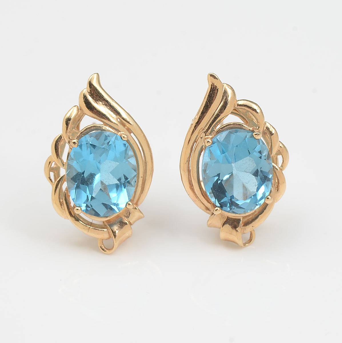 Appraisal: K TOPAZ EARRINGS K yellow gold earringscontain oval faceted blue