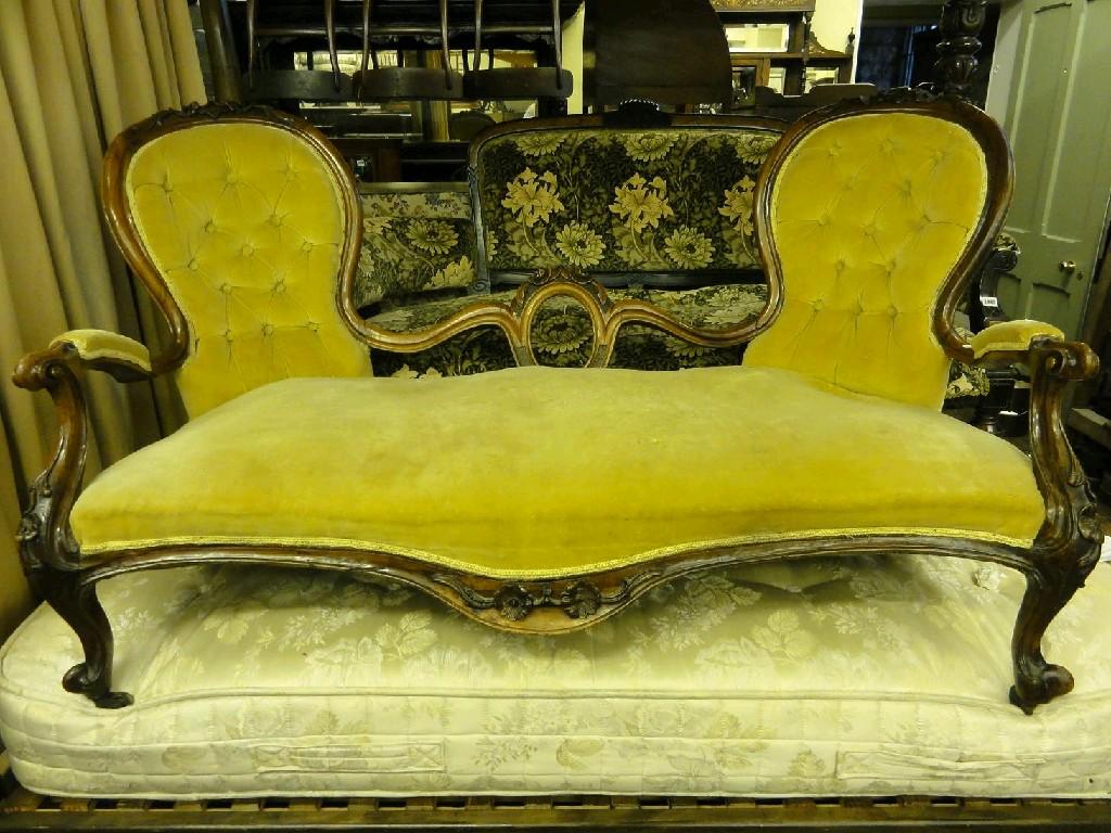 Appraisal: A Victorian double ended spoon back sofa with serpentine upholstered