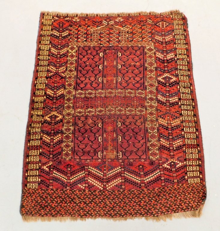 Appraisal: TEKKE BOKHARA RED GEOMETRIC CARPET Uzbekistan th CenturyRed blue Ivory