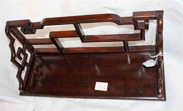 Appraisal: A CHINESE CARVED CHERRYWOOD WALL BRACKET with shaped supports long