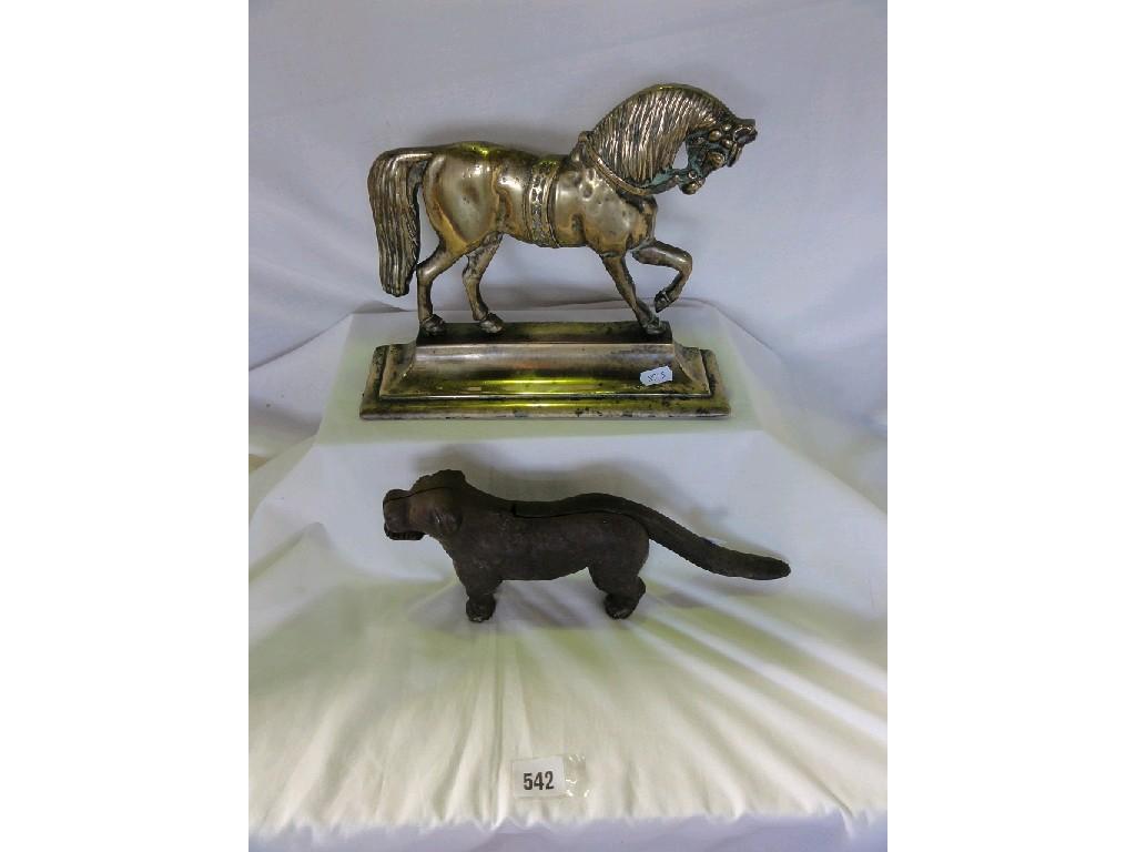 Appraisal: A brass doorstop in the form of a prancing circus