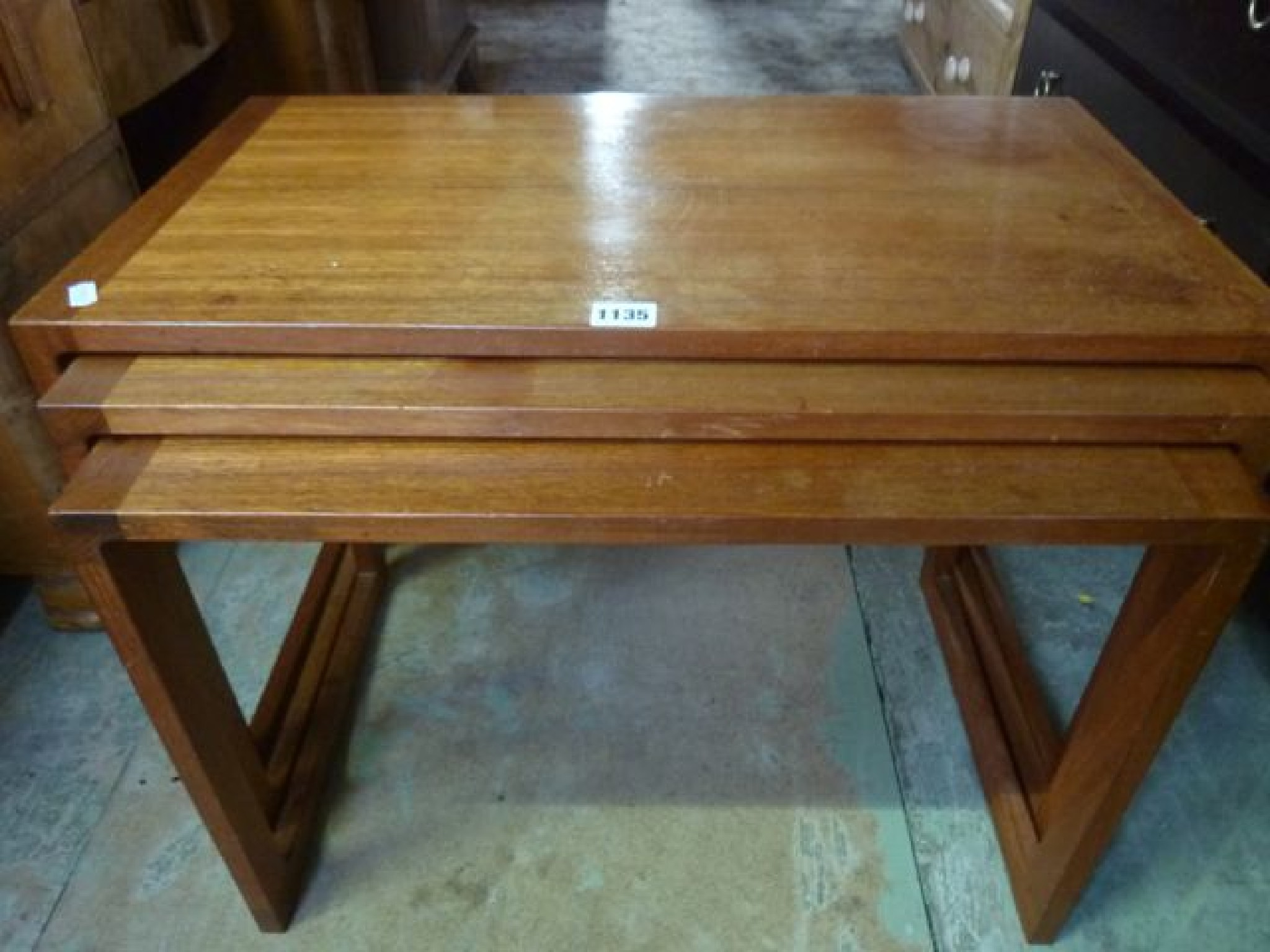 Appraisal: A nest of three mid th century teak graduated occasional