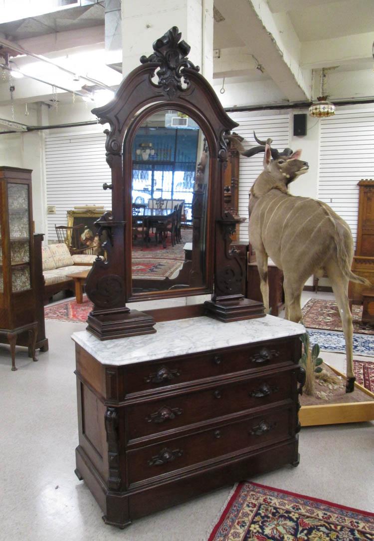 Appraisal: A VICTORIAN MARBLE-TOP WALNUT DRESSER American c - featuring a