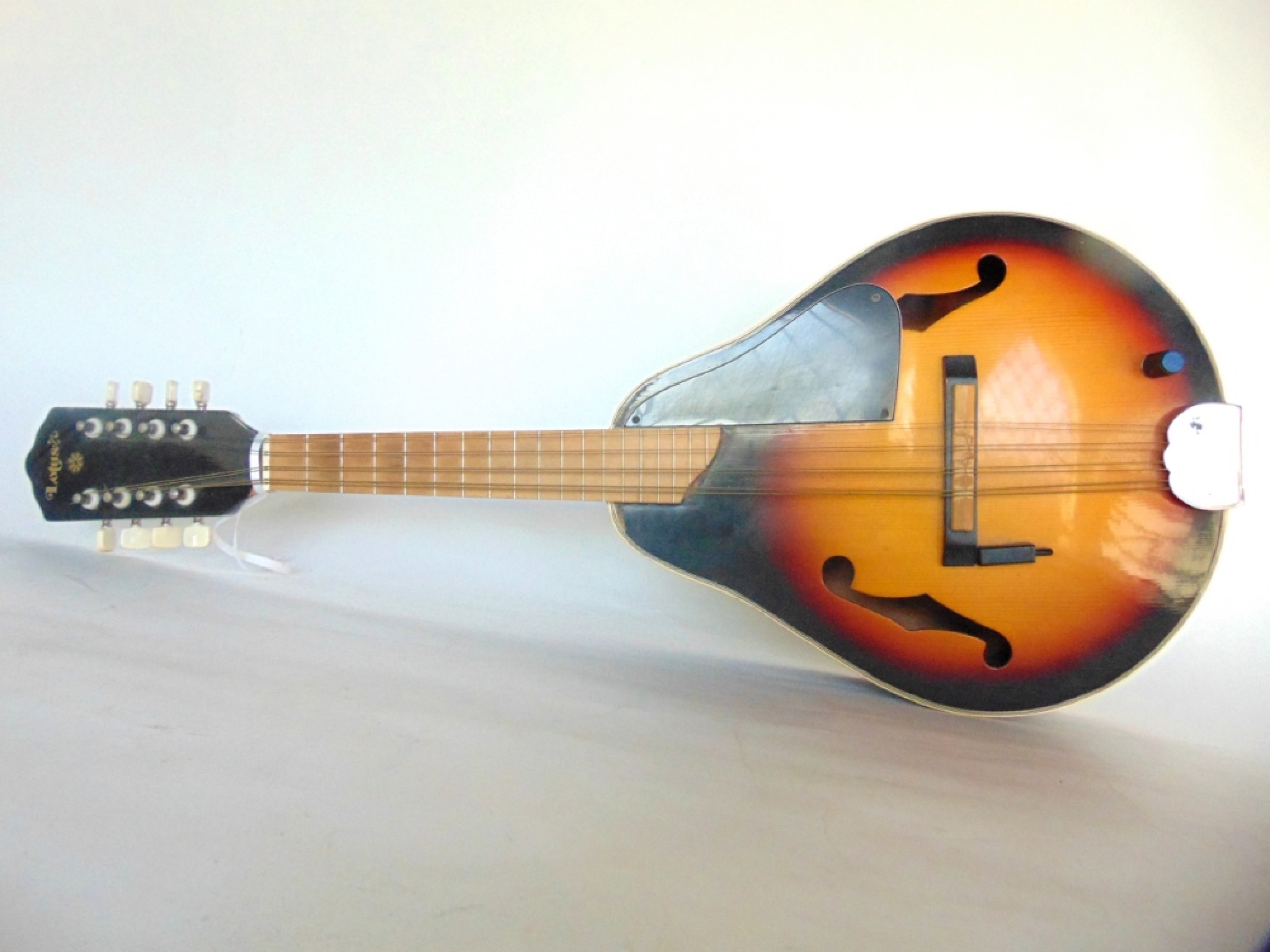 Appraisal: A Lotus string polished timber electric mandolin