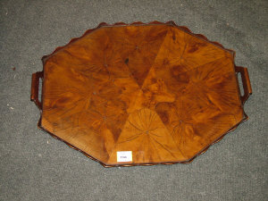 Appraisal: A yew wood octagonal tea tray late th century with