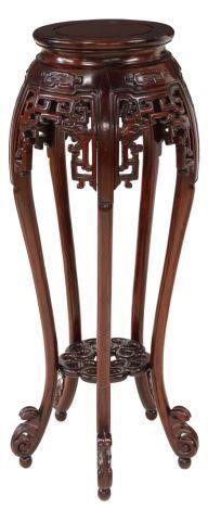 Appraisal: Chinese rosewood pedestal having round top over carved fretwork apron