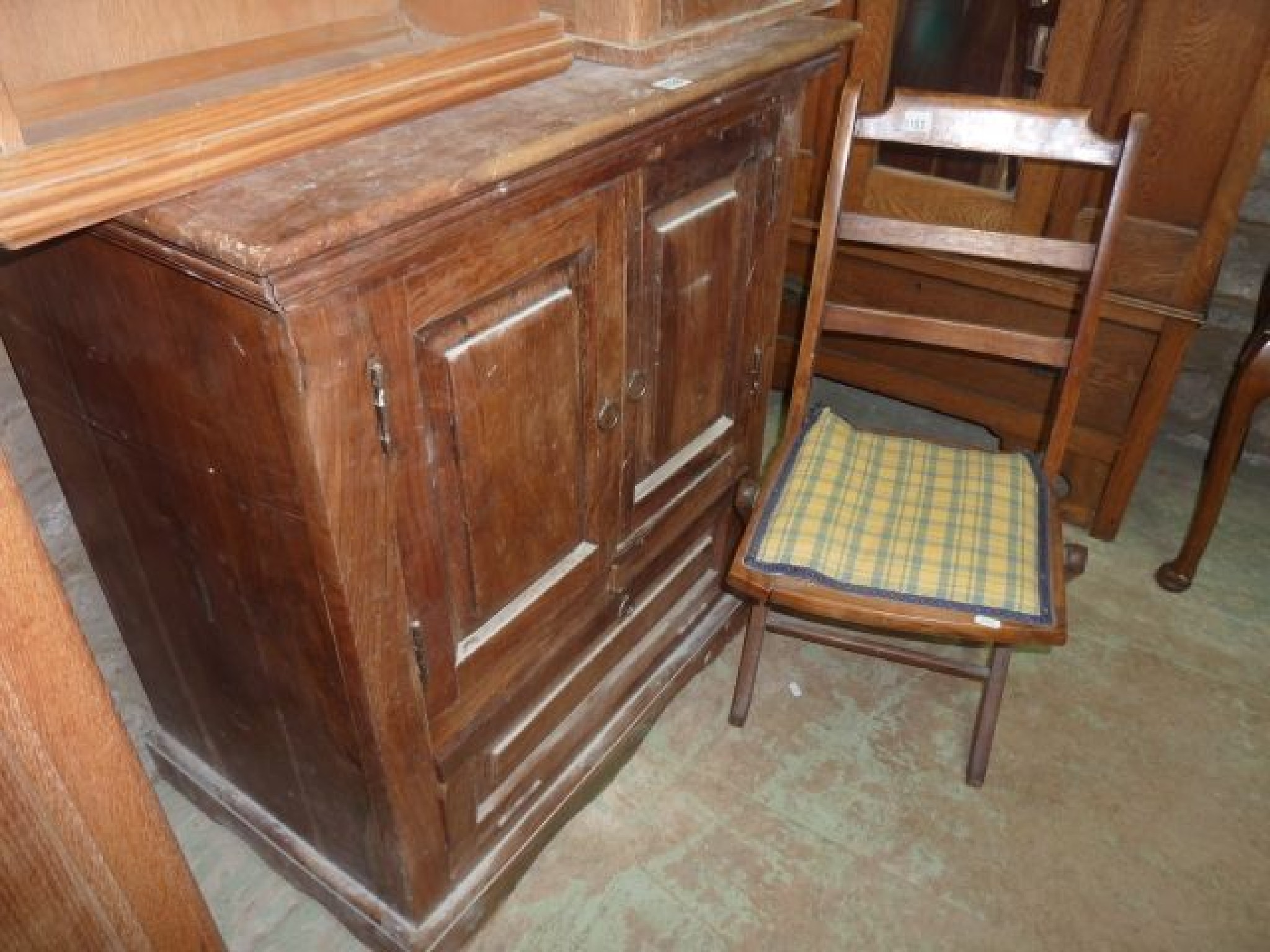 Appraisal: An Eastern hardwood side cupboard enclosed by two panelled doors