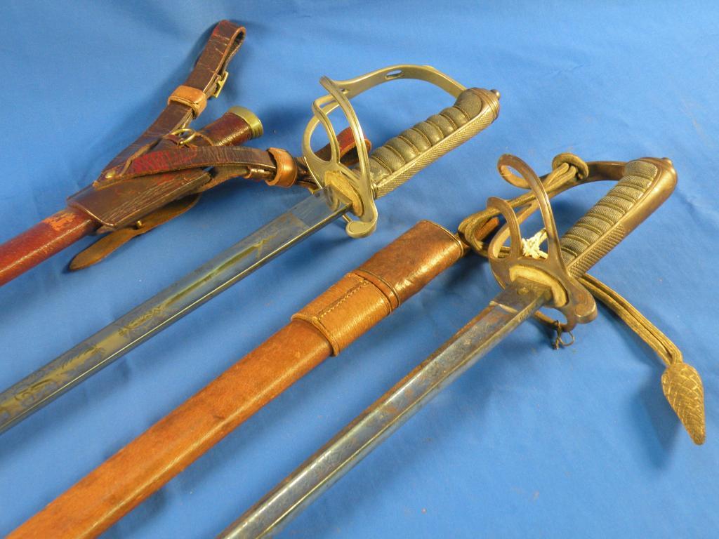 Appraisal: A Royal Artillery dress sword with leather scabbard the blade