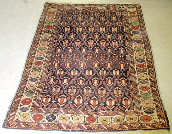 Appraisal: - Caucasian oriental mat with colorful geometric patterns x -