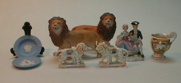 Appraisal: A pair of German porcelain Scarborough commemorative standing lions decorated