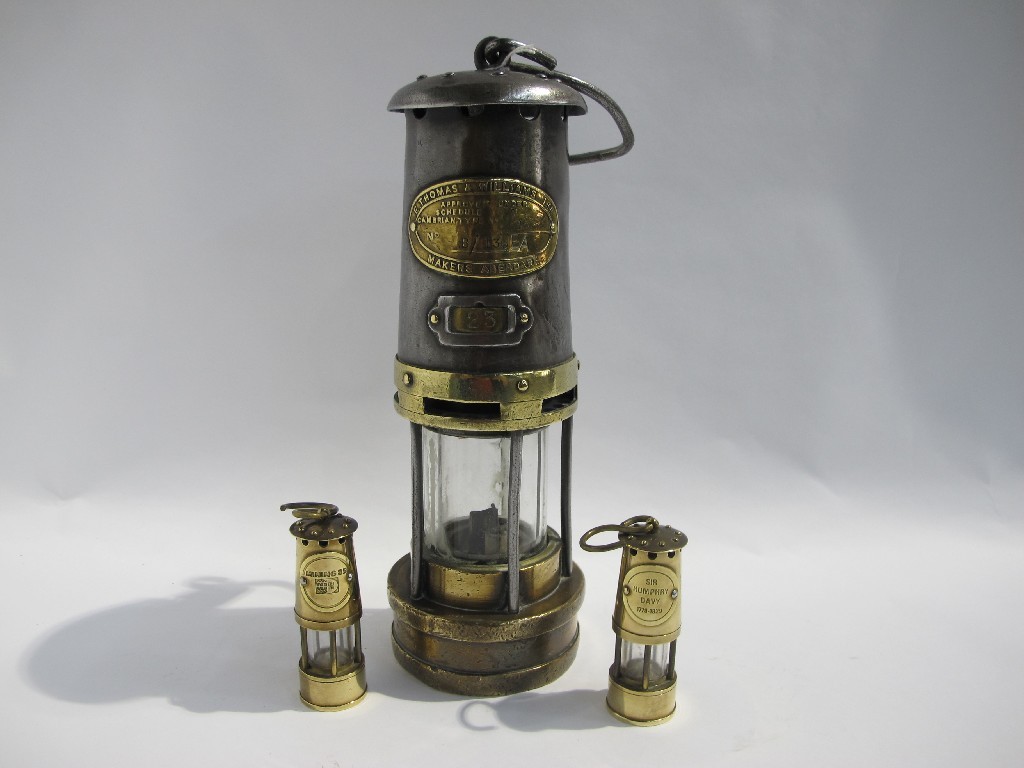 Appraisal: Lot comprising a miner's lamp with two miniature examples