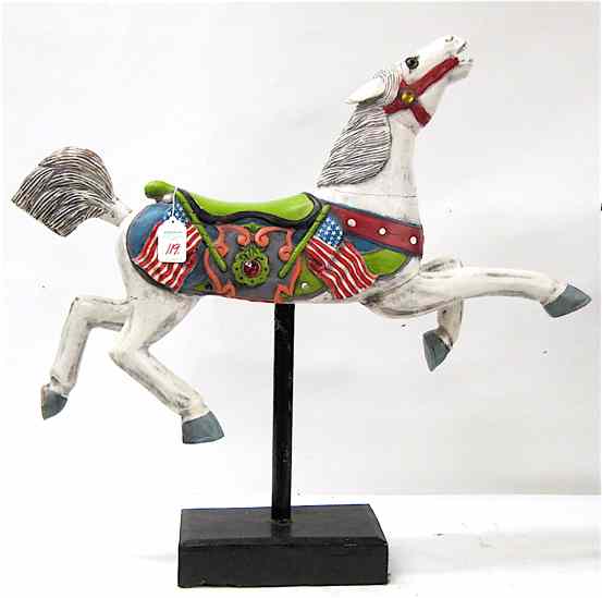 Appraisal: AN AMERICAN CAROUSEL CARVED WOODEN HORSE painted with four raised