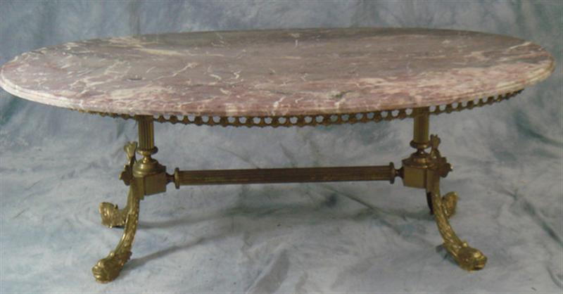 Appraisal: Oval brass marble top coffee table with dolphin legs x