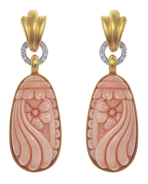 Appraisal: A PAIR OF CORAL AND DIAMOND EARRINGS The articulated carved