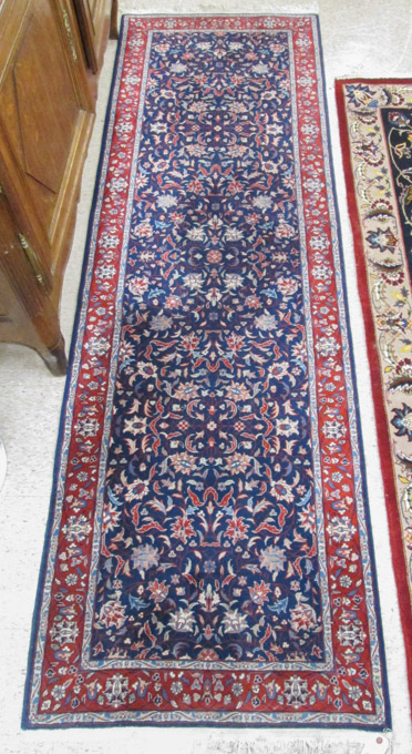 Appraisal: HAND KNOTTED ORIENTAL HALL RUG Pakistani Persian overall floral motif