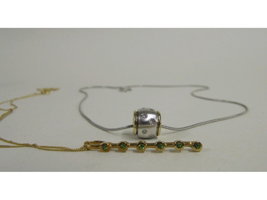 Appraisal: Lot comprising ct bi colour gold diamond set barrel pendant