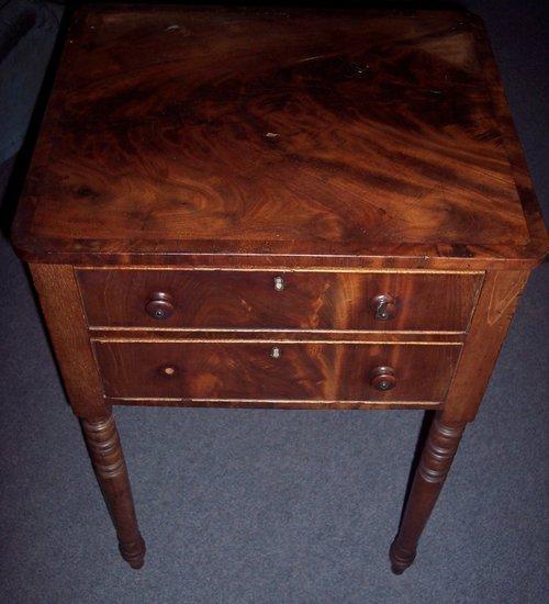 Appraisal: A rectangular mahogany bedside table fitted two drawers on turned