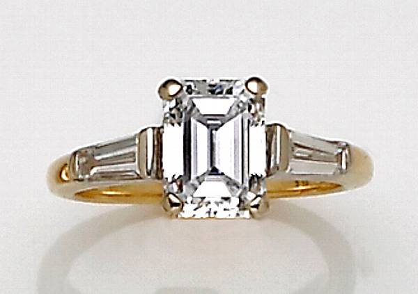 Appraisal: A diamond and eighteen karat gold ring the emerald-cut diamond