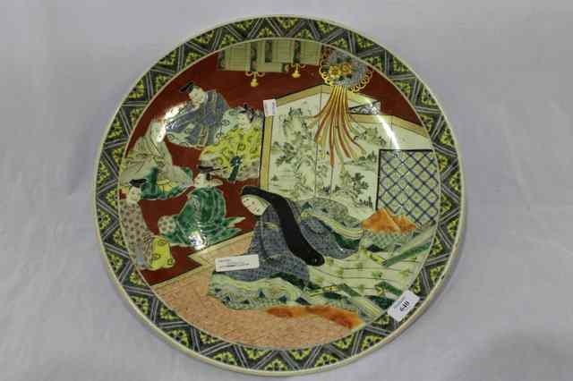 Appraisal: A LARGE JAPANESE CHARGER decorated in polychrome enamels with figures