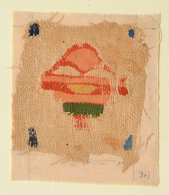 Appraisal: A TEXTILE FRAGMENT depicting an abstract or symbolic image on