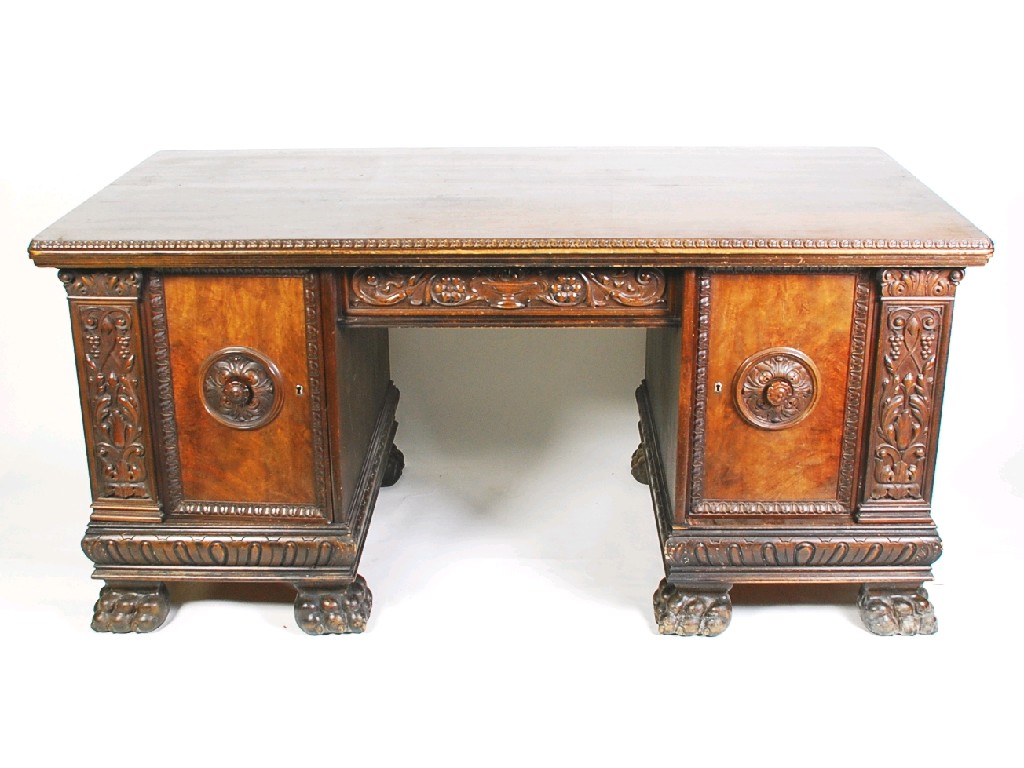 Appraisal: CONTINENTAL EARLY TWENTIETH CENTURY LARGE CARVED WALNUT AND BURR WALNUT