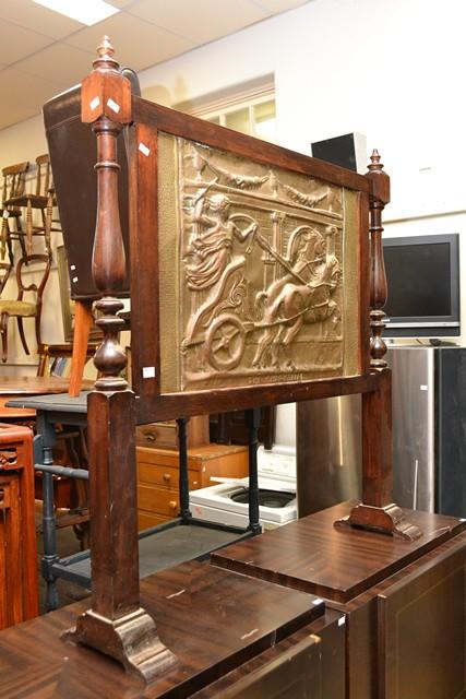 Appraisal: AN EDWARDIAN PRESSED COPPER AND BLACKWOOD FIRE SCREEN