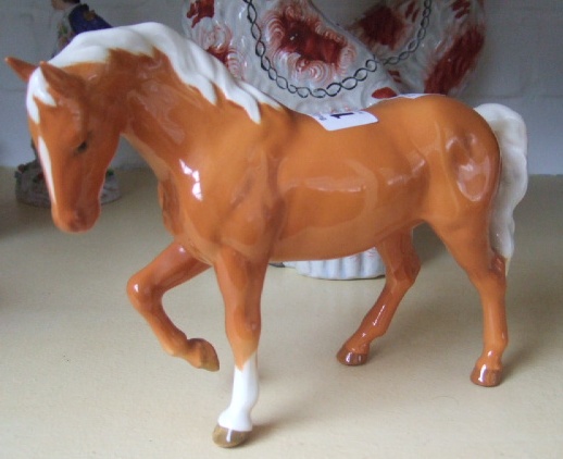 Appraisal: A Beswick figure of a Palomino horse light brown gloss