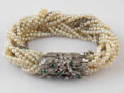 Appraisal: A seed pearl bracelet with a white metal tests carat