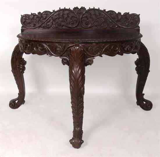 Appraisal: An Indo-Portuguese Carved Rosewood Demi-lune Console Table circa having a