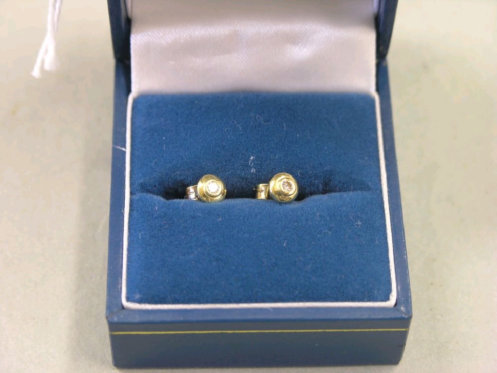 Appraisal: A pair of yellow metal and diamond ear rings each