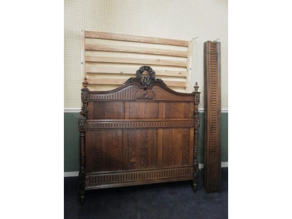 Appraisal: A French oak double bed head and foot with a