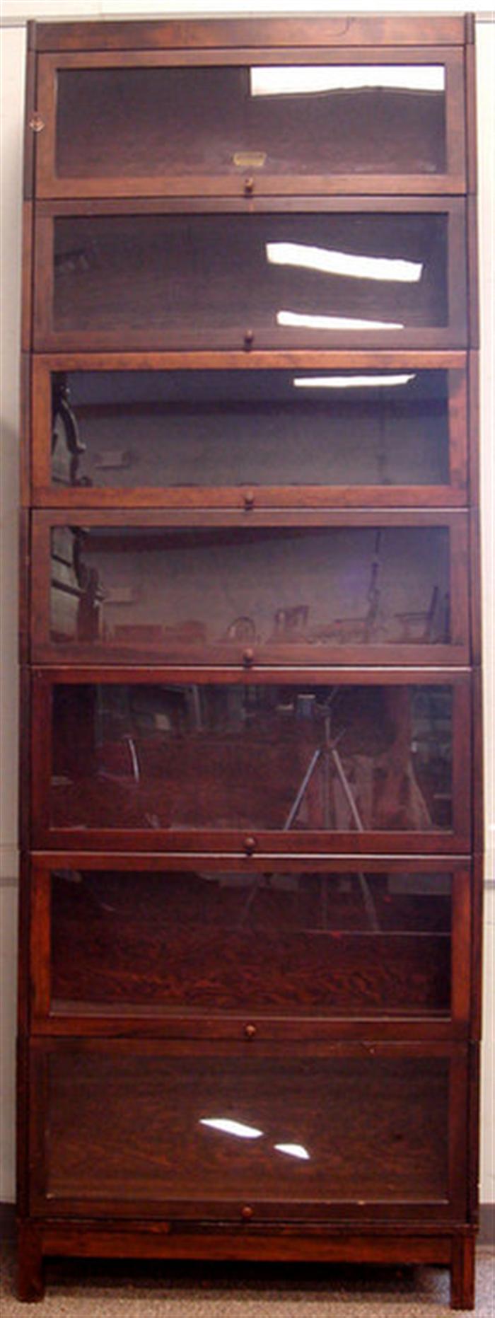 Appraisal: Seven section stacking barrister's bookcase walnut finished made by Lundstrom