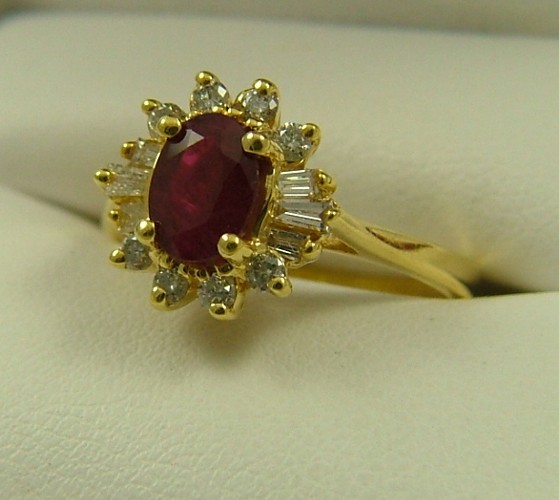 Appraisal: RUBY DIAMOND AND FOURTEEN KARAT GOLD RING centering an oval-cut