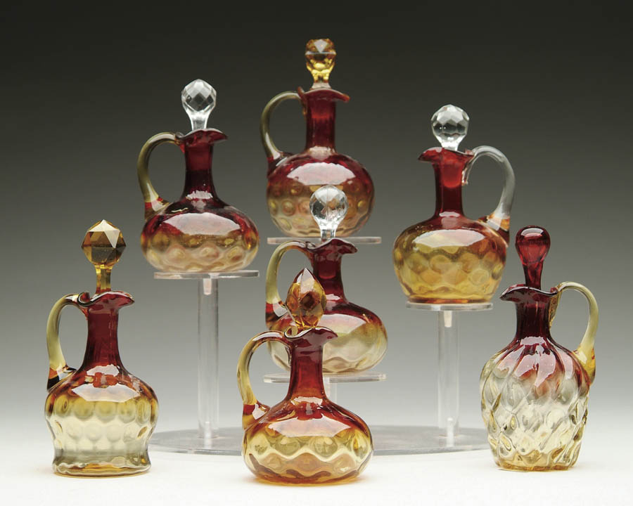 Appraisal: SEVEN AMBERINA CRUETS Lot consists of seven various shaped Amberina