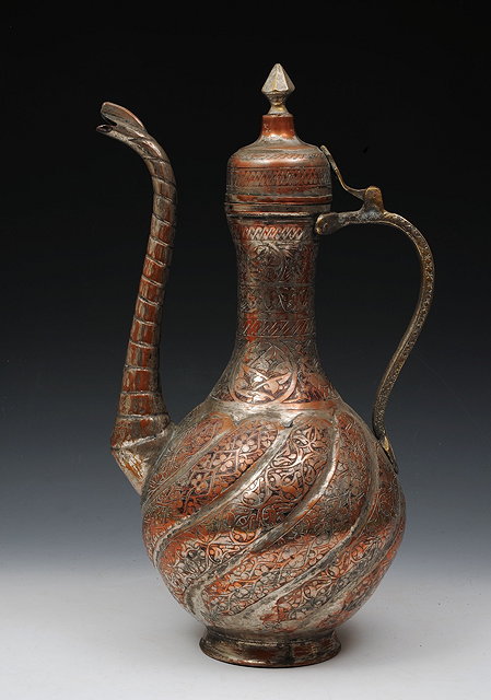 Appraisal: A LARGE INDIAN SILVERED COPPER EWER th Century cm high